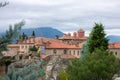 Greek Monastery with Red Roofs In Cloudy Weather