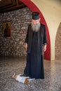 Greek Monk playing with his Cats