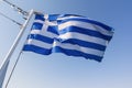 Greek national flag waving on the wind against blue sky Royalty Free Stock Photo