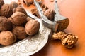 Greek nuts whole and split and the Nutcracker on wood Royalty Free Stock Photo