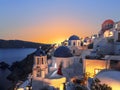 The Greek Orthodox Church on the background waters of the Aegean sea in Oia at sunset. The Island Of Santorini Royalty Free Stock Photo