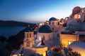 The Greek Orthodox Church on the background waters of the Aegean sea at sunset. Oia, the Island Of Santorini Royalty Free Stock Photo