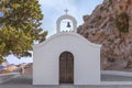 Greek Orthodox Church with brown door in Rhodes island with blue sky Royalty Free Stock Photo