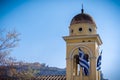 Greek Orthodox church detail with greek flags and Acropolis in the background Royalty Free Stock Photo