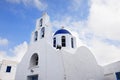 Greek orthodox church domes against the blue sky background and white clouds Royalty Free Stock Photo