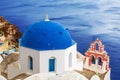 The Greek Orthodox Church in Oia town on Santorini island in Greece Royalty Free Stock Photo