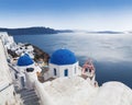 Greek Orthodox church of St. Nicholas on the background waters of the Aegean sea in Oia town on Santorini island Royalty Free Stock Photo