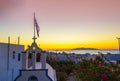 Greek Orthodox church tower with Greek flag waving Kamari Santorini Royalty Free Stock Photo