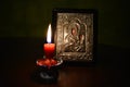 Greek orthodox icon with candle Royalty Free Stock Photo