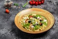 Greek Pasta Salad with tomato, avocado, black olives, red onions and cheese feta. Long banner format, top view Royalty Free Stock Photo