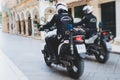 Greek police squad formation on duty riding bike and motorcycle and maintain public order in the streets of Kerkyra, Corfu, Greece