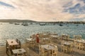 Greek restaurants and taverns are ready to welcome tourists at Alyki village in Paros island. Royalty Free Stock Photo