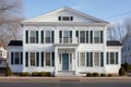 greek revival property with evenly spaced dormer windows