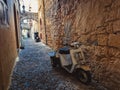 Greek Rhodes old town motorbike scooter alleyway.HDR effect