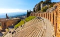 Greek and Roman Teatro antico Ancient Theatre with cavea auditorium in Taormina at Ioanian sea shore of Sicily in Italy