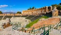 Greek and Roman Teatro antico Theatre with cavea seating auditorium in Taormina at Ioanian sea shore of Sicily in Italy