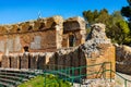 Greek and Roman Teatro antico Theatre with cavea seating auditorium in Taormina at Ioanian sea shore of Sicily in Italy