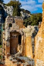 Greek and Roman Teatro antico Ancient Theatre with stage and arches colonnade ruins in Taormina of Sicily in Italy