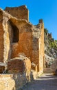 Greek and Roman Teatro antico Ancient Theatre with stage and arches colonnade ruins in Taormina of Sicily in Italy Royalty Free Stock Photo