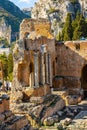 Greek and Roman Teatro antico Ancient Theatre with stage and arches colonnade in Taormina of Sicily in Italy Royalty Free Stock Photo