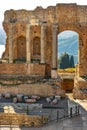 Greek and Roman Teatro antico Ancient Theatre with stage and arches colonnade ruins in Taormina of Sicily in Italy Royalty Free Stock Photo