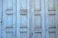 Greek rural wooden closed door background, texture. Light blue empty peeled board plank. Copy space Royalty Free Stock Photo