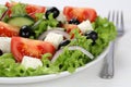 Greek salad in bowl or plate with tomatoes, Feta cheese and olives Royalty Free Stock Photo