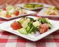 Greek salad with cheese, juicy tomatoes, red pepper, red onion, cucumber and lettuce Royalty Free Stock Photo