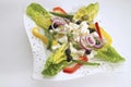 greek salad with cheese on palte, top view.