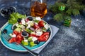 Greek salad. Diced tomatoes, cucumbers, feta cheese, olives.