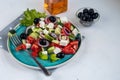 Greek salad. Diced tomatoes, cucumbers, feta cheese, olives.