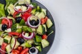 Greek salad. Diced tomatoes, cucumbers, feta cheese, olives.