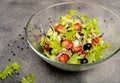 Greek salad with feta cheese, organic black olives, juicy tomatoes, red pepper, red onion, cucumber and lettuce. Close Royalty Free Stock Photo