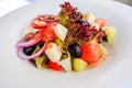 Greek salad with feta cheese, organic kalamata olives, juicy tomatoes, red pepper, red onion, cucumber and lettuce. Concept for Royalty Free Stock Photo