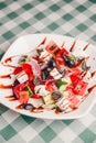 Greek salad with feta cheese, organic olives, juicy tomatoes, red pepper, red onion, cucumber and lettuce. Royalty Free Stock Photo