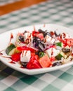 Greek salad with feta cheese, organic olives, juicy tomatoes, red pepper, red onion, cucumber and lettuce. Royalty Free Stock Photo