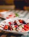 Greek salad with feta cheese, organic olives, juicy tomatoes, red pepper, red onion, cucumber and lettuce. Royalty Free Stock Photo