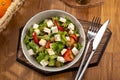 Greek salad with feta cheese, organic olives, juicy tomatoes, red pepper, red onion, cucumber and lettuce Royalty Free Stock Photo