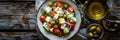 Greek salad food photography with fresh ingredients on wooden table in natural light Royalty Free Stock Photo