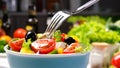 Greek salad on fork, fresh vegetable salad served with healthy food ingredients Royalty Free Stock Photo