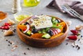 Greek salad of fresh cucumber, tomato, sweet pepper, lettuce, red onion, feta cheese and olives with olive oil. Healthy food, top Royalty Free Stock Photo