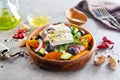 Greek salad of fresh cucumber, tomato, sweet pepper, lettuce, red onion, feta cheese and olives with olive oil. Healthy food, top Royalty Free Stock Photo