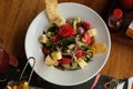 Greek salad of fresh cucumber, tomato, sweet pepper, red onion, feta cheese and olives with olive oil. Healthy food, top view Royalty Free Stock Photo