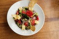 Greek salad of fresh cucumber, tomato, sweet pepper, red onion, feta cheese and olives with olive oil. Healthy food, top view Royalty Free Stock Photo