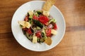 Greek salad of fresh cucumber, tomato, sweet pepper, red onion, feta cheese and olives with olive oil. Healthy food, top view Royalty Free Stock Photo