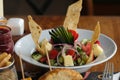 Greek salad of fresh cucumber, tomato, sweet pepper, red onion, feta cheese and olives with olive oil. Healthy food, top view Royalty Free Stock Photo