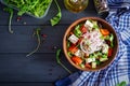 Greek salad with fresh tomato, cucumber, red onion, basil, feta cheese