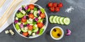 Greek salad with fresh tomatoes olives and feta cheese healthy eating food banner from above on a slate Royalty Free Stock Photo