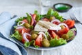 Greek salad of fresh vegetable with tomatoes, lettuce, olives, red onion and feta cheese Royalty Free Stock Photo