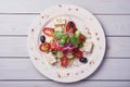 Greek salad with fresh vegetables, feta cheese and black olives. Top view Royalty Free Stock Photo